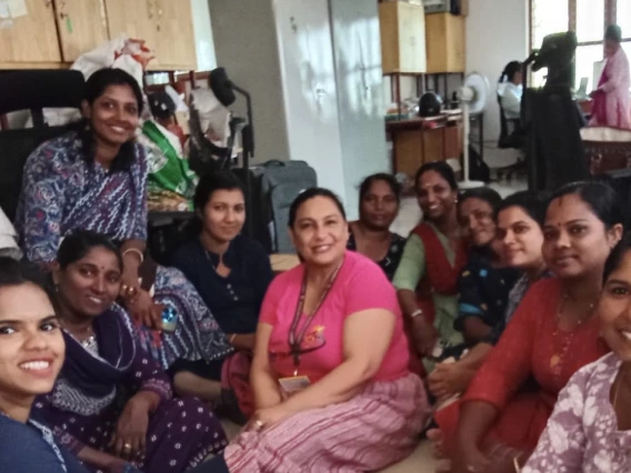 Beatriz Winters with members of the Sivasakthi Tailoring Unit